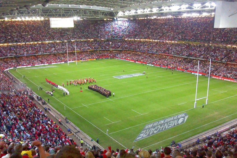 Excited fans enjoying Links Hospitality's Rugby Hospitality package at a Rugby International match.